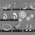 Various Metal Sculptures with Geometric Shapes and Human Forms on Black Slate Bases