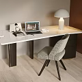 Modern Desk with White Marble Top Laptop Lamp Books Photo Frame and Grey Upholstered Chair