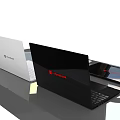 Three Modern Black And White Laptops With Blue Abstract Screens On Table