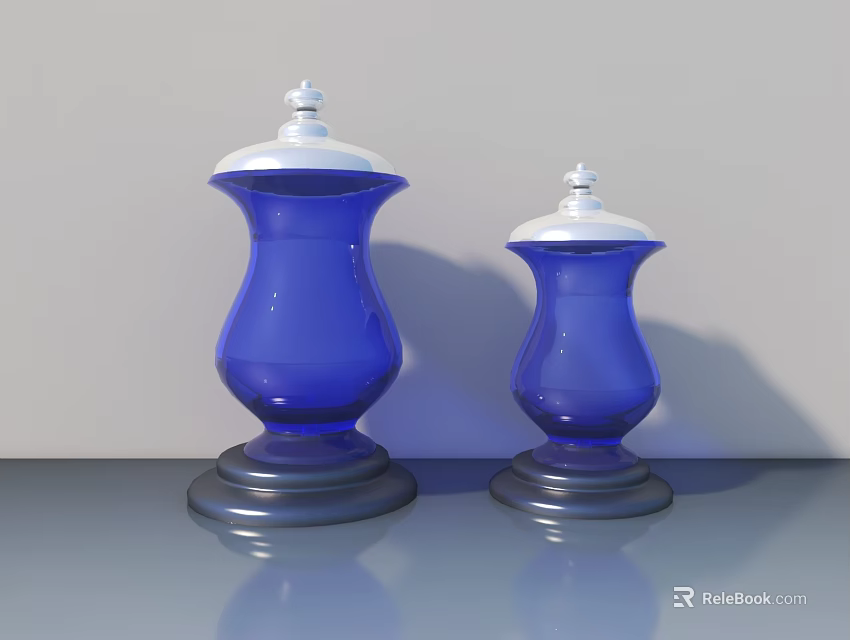 Two Carved Blue Vases with White Lids on Gray Countertop and Light Gray Background 3d model 