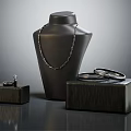 Elegant Jewelry Display Featuring Necklace Ring Earrings On Black Display Stand With Black Boxes