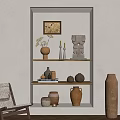 Minimalist Beige Niche With Shelves Displaying Rustic Pottery Candles And Sculptures