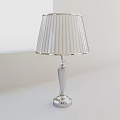 Modern Silver Table Lamp With Transparent Striped Lampshade And Sleek Base Design