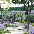 Courtyard Garden Design With Outdoor Seating Stone Pathway Purple Flowers And Green Shrubs