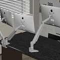 Ergonomic Monitor Stands Supporting Apple Displays On Black Office Desk