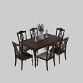 Wooden Dining Table And Chairs Set With Decorative Vase Flowers And Candles On Table