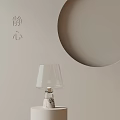 Serene Glass Lampshade Table Lamp With Marble Base On Light Colored Background And Circular Decoration
