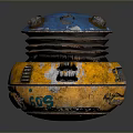Worn Round Mechanical Object With Blue Top Yellow Base And Side Labels