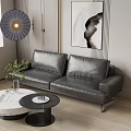 Modern Two-Seater Leather Sofa Interior With Round Coffee Table Green Plants And Abstract Painting
