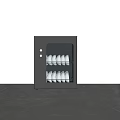 Modern Black Kitchen Dish Sterilizer Appliance With White Dishes On Marble Countertop