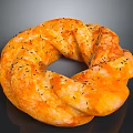 Golden Orange Ring Shaped Bread With Black Sesame Seeds And Twisted Texture