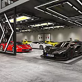 Automotive Showroom Interior With Luxury Cars Reception Desk And Tires