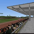 Soccer Field With Players In Action During Match With Spectators In Stands