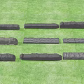 Stone Wood Long Strips With Natural Textured Surface Displayed On Green Grass