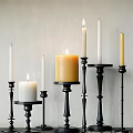 Elegant Black Candle Holders With Various Heights Lit White And Yellow Candles Decorative