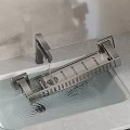 Modern Kitchen Faucet And Metal Dish Rack In Sink With Dripping Water