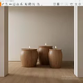 Three Wooden Candle Holders With Lit Candles On Light Colored Wall And Wooden Floor