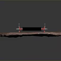 Hardware Tools Black Roller With Red Brackets And Metal Components On Rock Surface