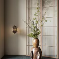 Japanese Bonsai Plant with Green Leaves and White Flowers in Brown Vase by Wooden Lattice