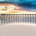 Scenic Coastal Landscape With Metal Railing Stone Paved Floor And Vibrant Sunset Sky