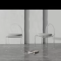 Modern Transparent Frame Leisure Chairs With Gray Cushion On Gray Floor Against Light Colored Wall