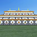 Traditional Multi tiered Religious Building With Blue White Design And Golden Spires On Green Grass