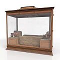 Antique Wooden Display Case With Glass Front And Ornate Carved Base Holding Artifacts