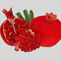 Ripe Fresh Red Pomegranate Halved With Juicy Seeds And Green Leaves