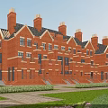 Traditional Red Brick Terraced Houses With Multiple Chimneys Dark Roofs And Front Lawn Hedges
