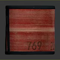 Red Cylindrical Woven Fabric Container With Dark Trim And Textured Surface Design