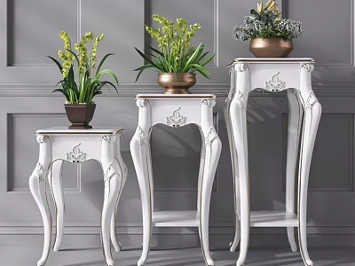 Three White Carved Plant Stands with Green Plants Against Gray Wall 3d model