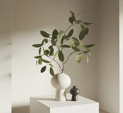 Elegant White Round Vase With Green Leaves On White Tabletop And Small Black Decor 3d model