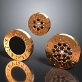 Golden Circular Decorative Household Items With Engraved Letters And Black Gemstones