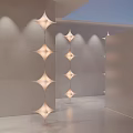 Modern Star Shaped Chandeliers Hanging In Minimalist Indoor Space With Soft Lighting