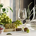 Fresh Green Grapes Cherries And Green Apple On White Table With Cheese And Wine Glass