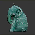 Turquoise Elephant Shaped Candle With Intricate Decorative Details On Black Background