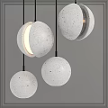Spherical Concrete Pendant Lights Featuring Warm Inner Glow And Modern Hanging Design