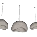 Three Modern Textured Cream Colored Dome Pendant Lights With Warm Yellow Glow