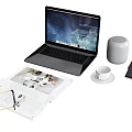 Modern Laptop Workspace With Smart Speaker Phone Coffee Mug And Open Magazine
