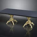 Luxurious Black Table with Intricate Gold Carved Legs and Sleek Surface