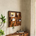 Wooden Wall Mounted Shelf With Decorative Items And Green Plant Near Light Wall