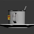 Silver Cup With Label Containing Dark Liquid And Metal Spoon On White Wavy Edge Plate