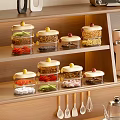 Glass Spice Jars with Colored Lids on Wooden Shelf Holding Various Seasonings