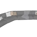 Large Curved Sectional Sofa With Gray Velvet Upholstery Multiple Decorative Cushions And Warm Throw Blanket