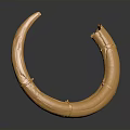 Golden Circular Metal Sculpture With Shiny Surface And Curved Design Details