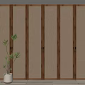 Modern Wooden Wardrobe Design With Panel Doors And Indoor Plant In Home Interior