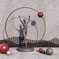 Decorative Human Figure Sculpture With Raised Arms Metal Ring Colored Spheres Against Textured Wall