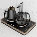 Modern Electric Kettle and Glass Teapot on Black and Gold Heating Base for Daily Use