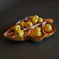 Leaf Shaped Wooden Bowls Holding Fresh Yellow Pears On Black Surface