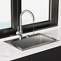 Stainless Steel Kitchen Sink with Modern Faucet on Marble Countertop near Window